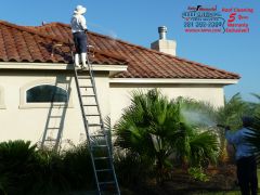 Katy-Memorial Roof Cleaning & Power Washing cleaning a tile roof in Katy, Tx.