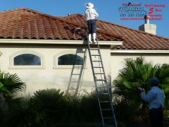 Marcus cleaning the tile roof